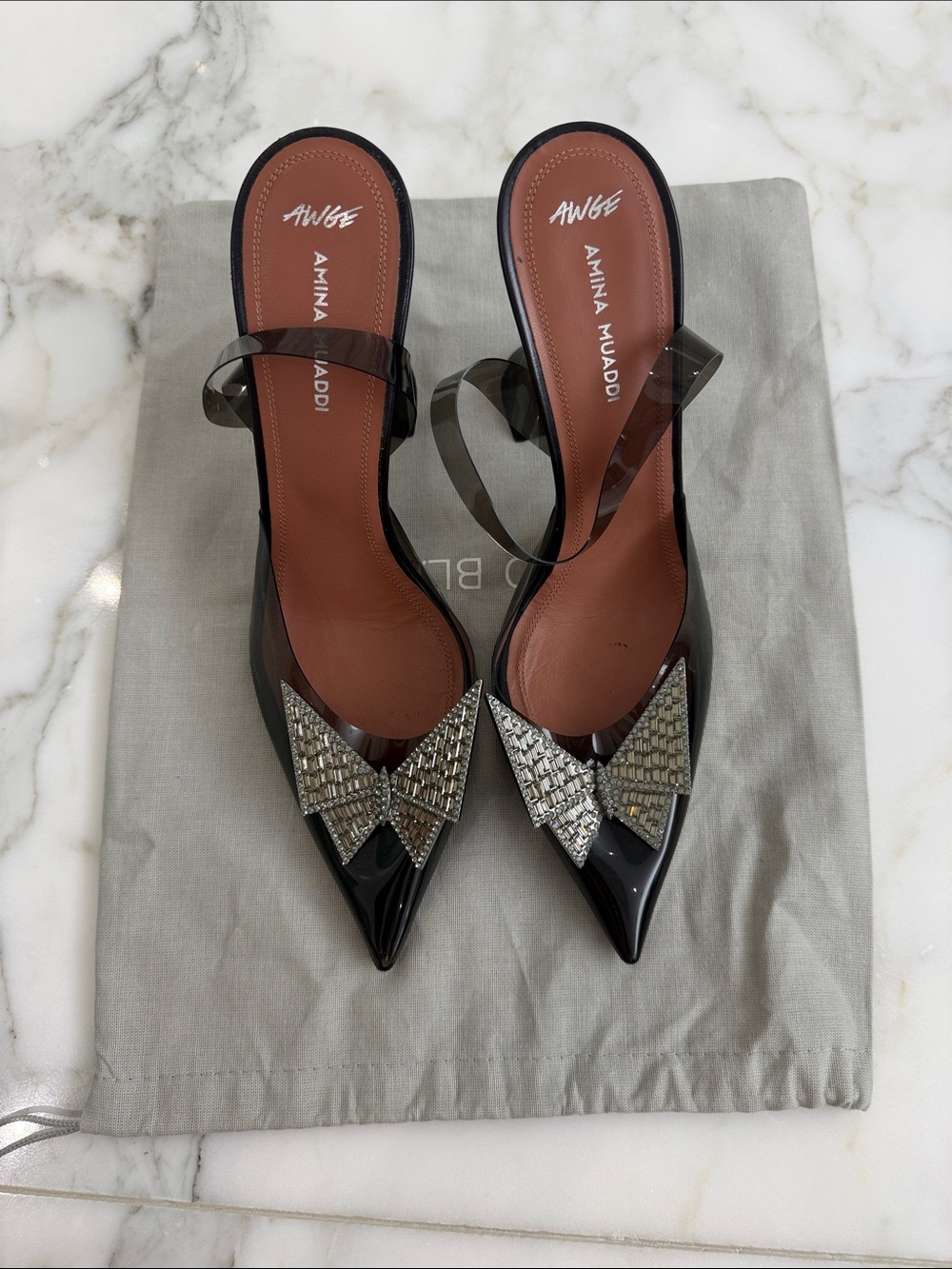 Amina Muaddi Black Patent Pointed Slingbacks with Crystal Bow